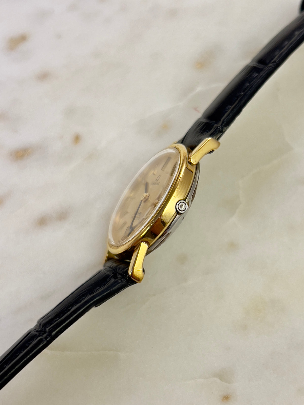 Omega Round Gold Toned Woman's Watch, wrist shot of a vintage women's watch at Gilded Hour.