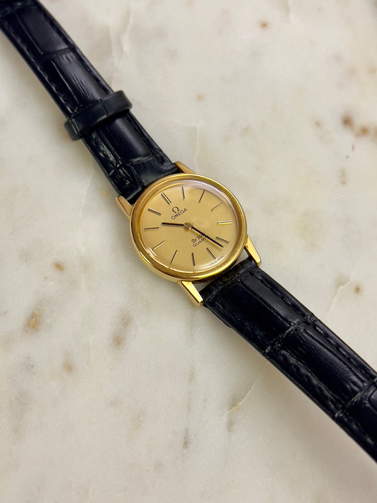 Omega Round Gold Toned Woman's Watch, bracelet detail of a vintage women's watch at Gilded Hour.