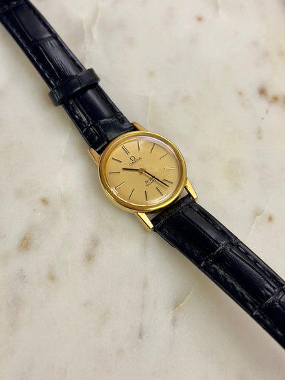 Omega Round Gold Toned Woman's Watch, bracelet detail of a vintage women's watch at Gilded Hour.