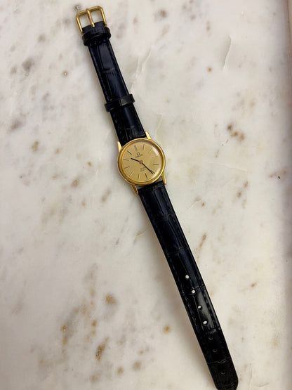 Omega Round Gold Toned Woman's Watch, caseback detail of a vintage women's watch at Gilded Hour.