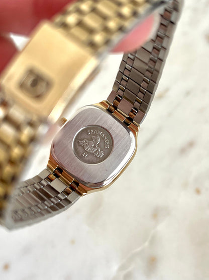 Omega Seamaster 596.0051 caseback with the embossed seahorse medallion and bracelet underside.