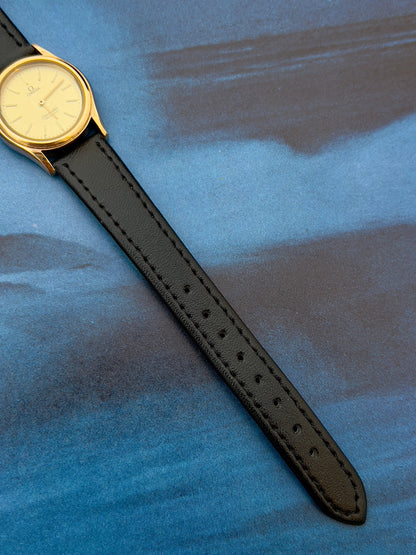 Angled view of the Omega Seamaster gold watch with champagne dial.