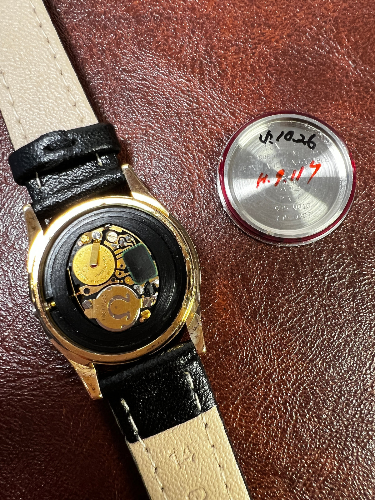 Caseback detail of the Omega Seamaster gold watch.