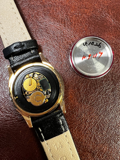 Caseback detail of the Omega Seamaster gold watch.