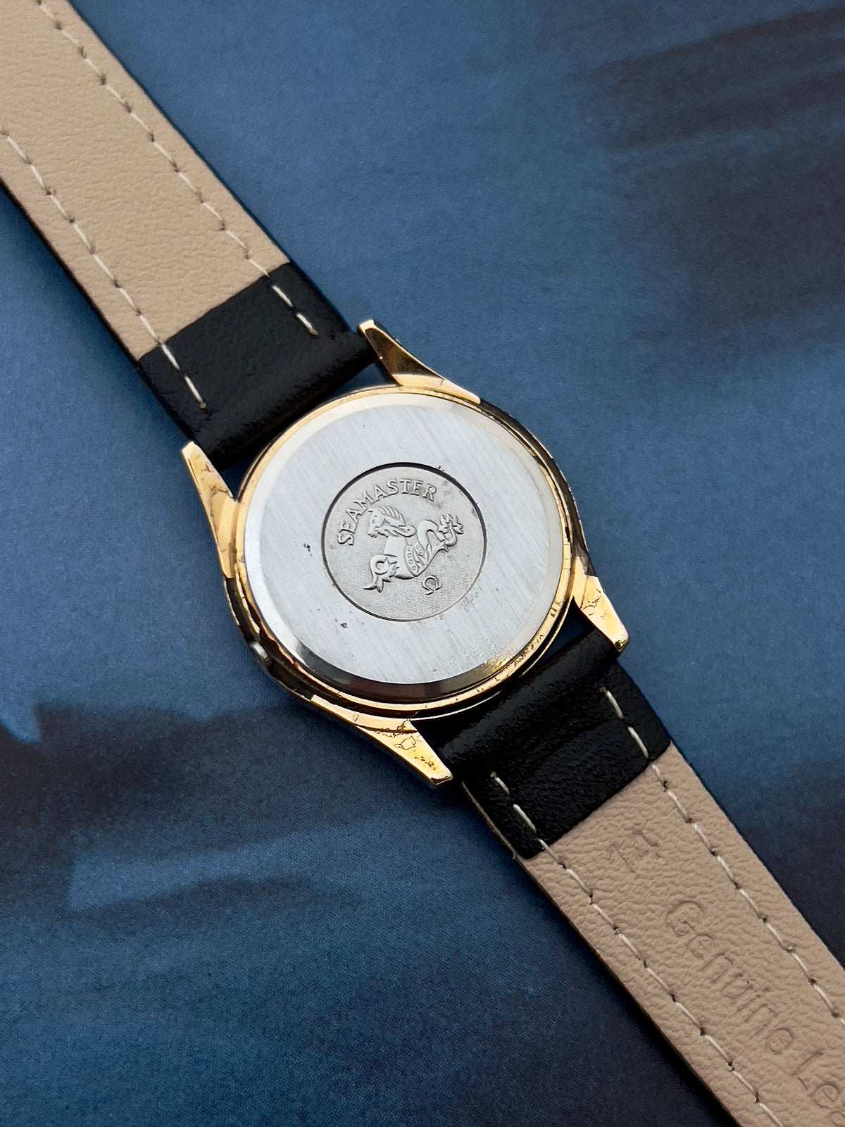Close-up of the champagne dial on the Omega Seamaster.