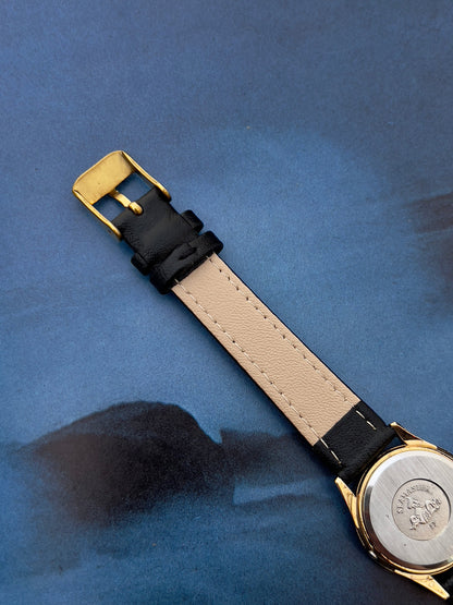 Detail of the champagne dial on the Omega Seamaster.