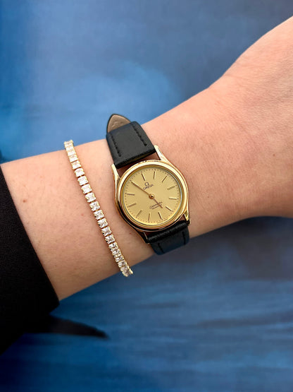 Front view of the Omega Seamaster gold watch with champagne dial.