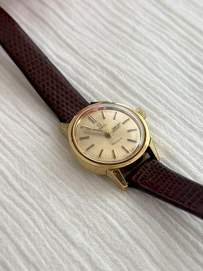 Omega Geneve Automatic Gold Ladies Watch with Champagne Sunburst Dial