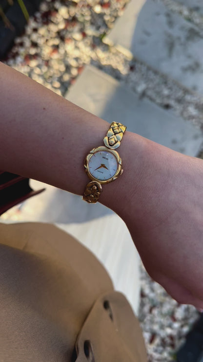 Seiko Exceline Gold Toned Woman's Watch with Radiant Mother of Pearl Dial