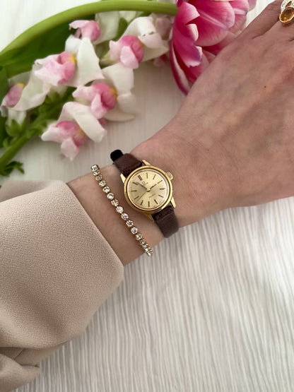 Omega Geneve Automatic Gold Ladies Watch with Champagne Sunburst Dial