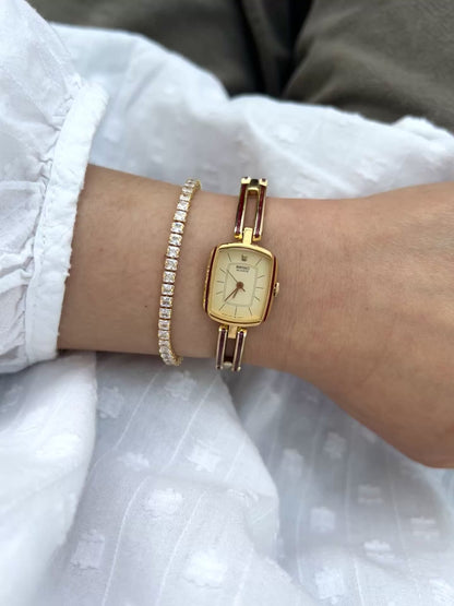 Seiko Ladies Gold Bracelet Watch with Crimson Enamel Accents