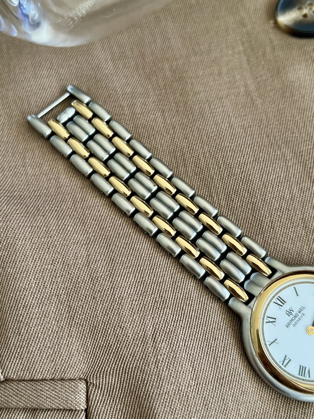 Rounded steel and gold tone links on the Raymond Weil Fidelio bracelet