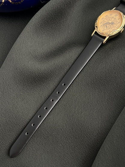 Black leather strap and adjustment holes on the Seiko 1E20-0370 watch