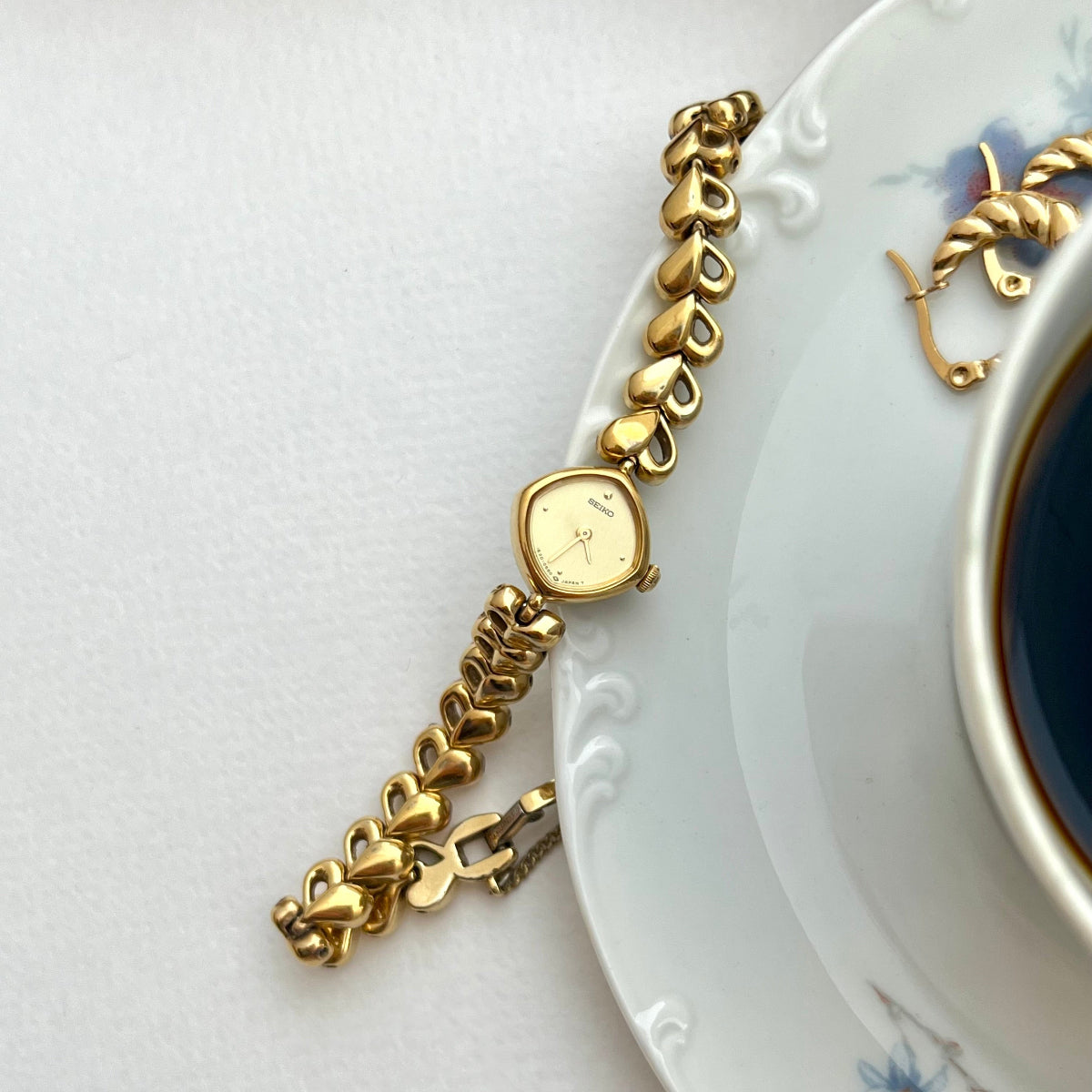 Seiko Gold Toned Women's Watch with Hearts Bracelet, bracelet detail of a vintage women's watch at Gilded Hour.