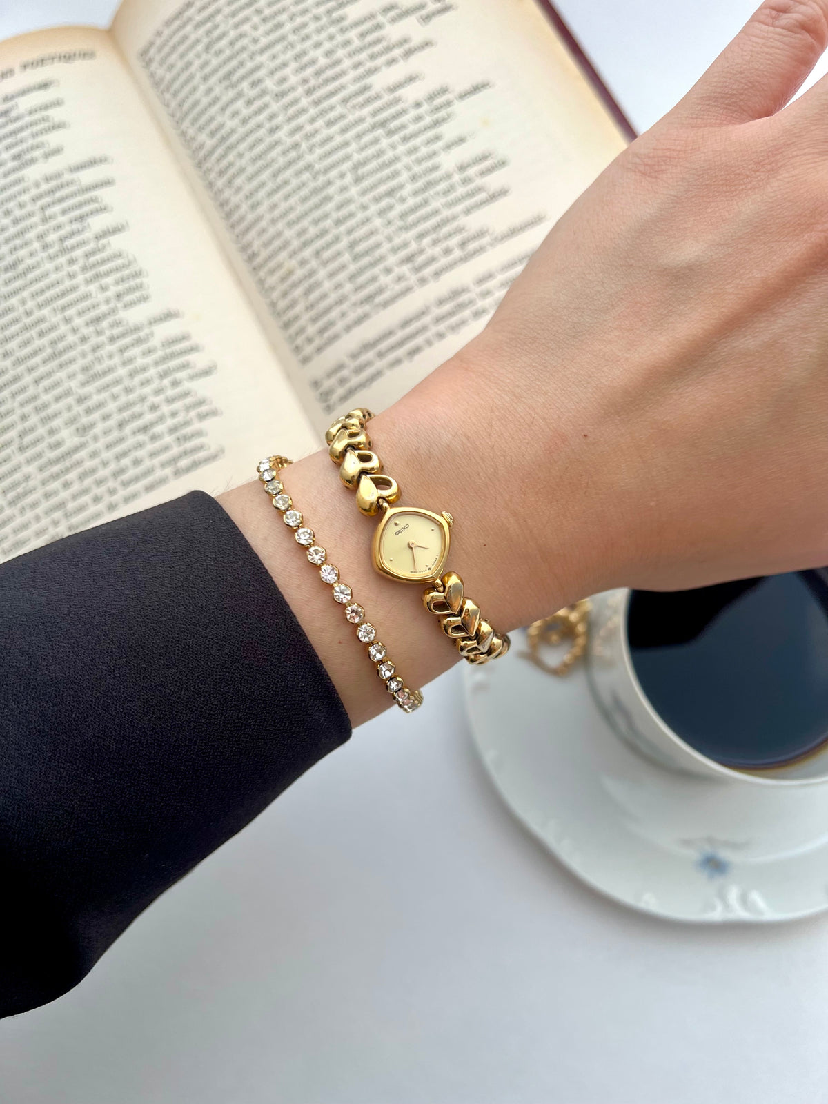 Seiko Gold Toned Women's Watch with Hearts Bracelet, angled view of a vintage women's watch at Gilded Hour.