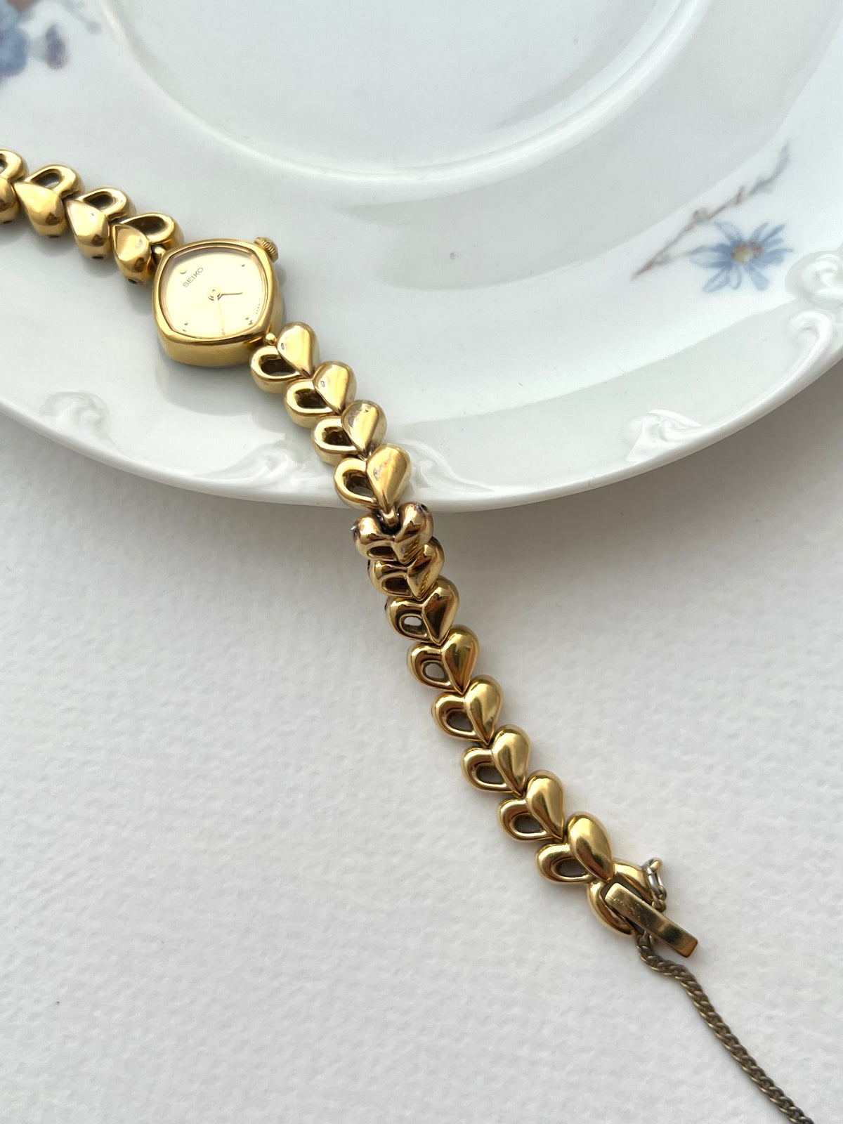 Seiko Gold Toned Women's Watch with Hearts Bracelet, case profile of a vintage women's watch at Gilded Hour.