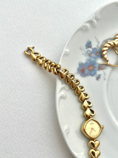 Seiko Gold Toned Women's Watch with Hearts Bracelet, bracelet detail of a vintage women's watch at Gilded Hour.