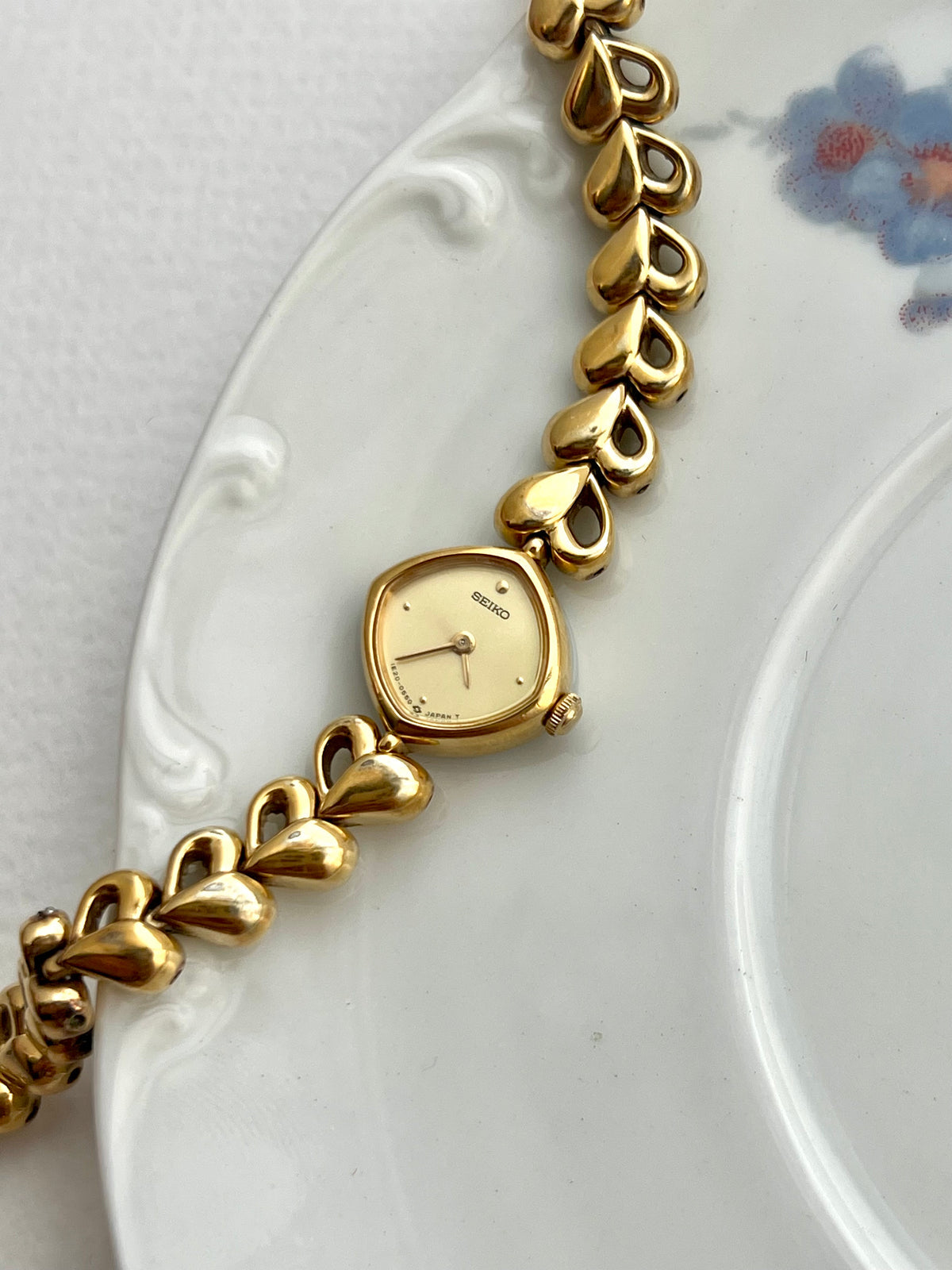 Seiko Gold Toned Women's Watch with Hearts Bracelet, caseback detail of a vintage women's watch at Gilded Hour.