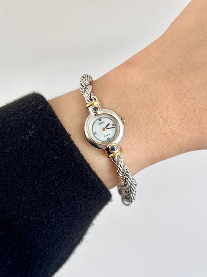 Seiko Exceline women’s watch with a white Roman numeral dial, two-tone case, and original rope bracelet.