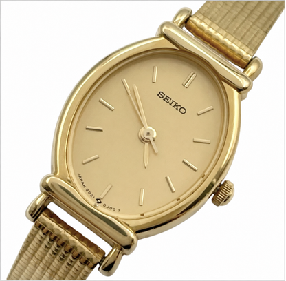 Front view of the Seiko 2P21-5D10 gold-tone watch with champagne dial and applied baton markers