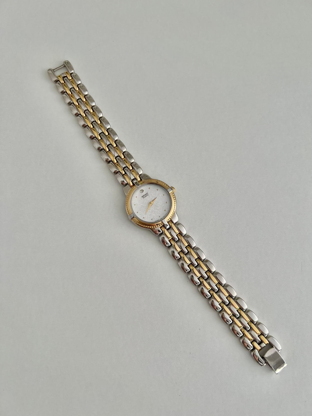 Presentation box shown with the Seiko 4N00-0910 diamond-accent two-tone women’s watch.
