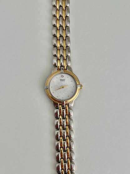 Seiko 4N00-0910 diamond-accent two-tone watch shown on the wrist.