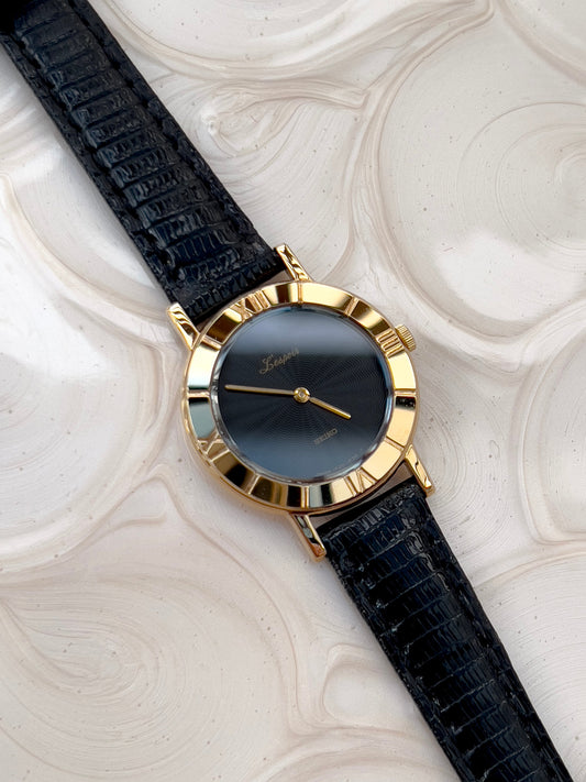 Seiko Guilloche Pattern Black Dial Woman's Watch — watch face and case shown from the front.