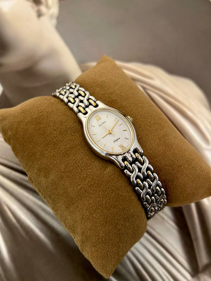 Seiko Belfina two-tone bracelet watch shown on a wrist.
