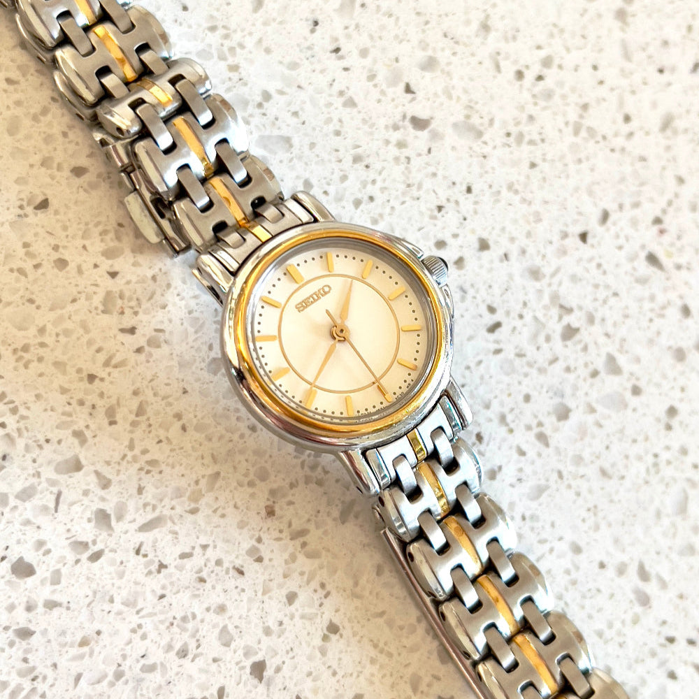 Seiko Two Tone Woman's Watch with Black Crown Stone, dial close up of a vintage women's watch at Gilded Hour.