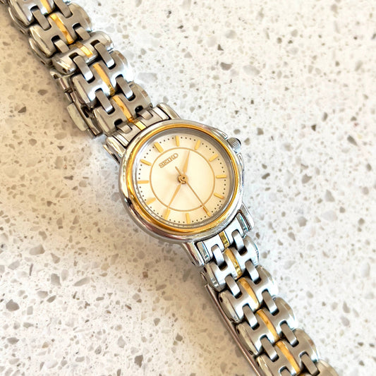 Seiko Two Tone Woman's Watch with Black Crown Stone, dial close up of a vintage women's watch at Gilded Hour.