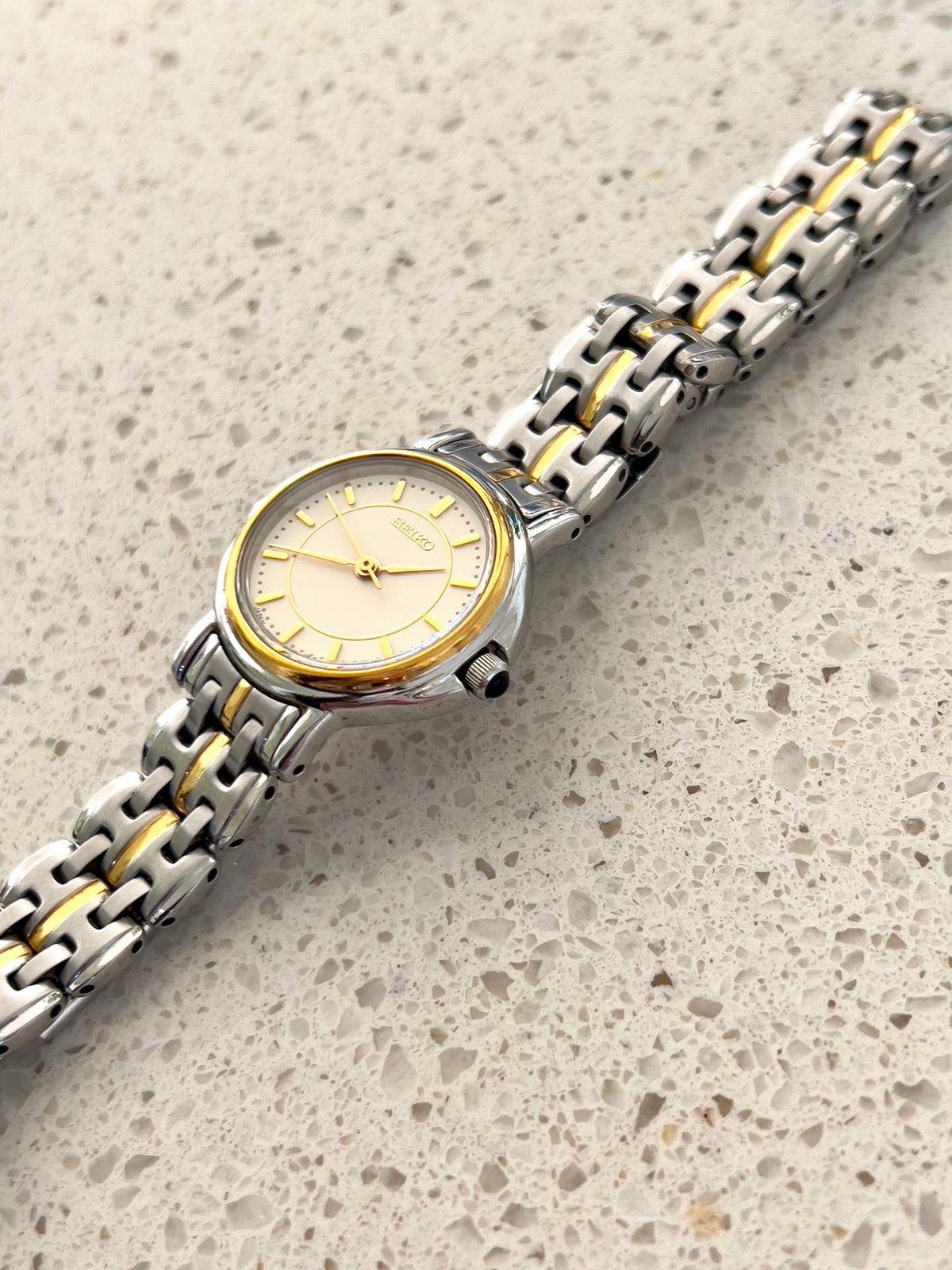 Seiko Two Tone Woman's Watch with Black Crown Stone, wrist shot of a vintage women's watch at Gilded Hour.