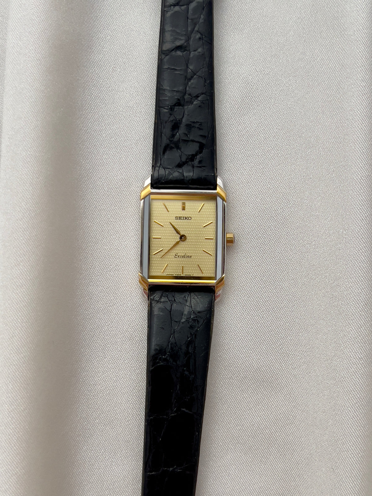 Seiko Exceline Tank Champagne Guilloché Dial Ladies Rectangular Watch, wrist shot of a vintage women's watch at Gilded Hour.