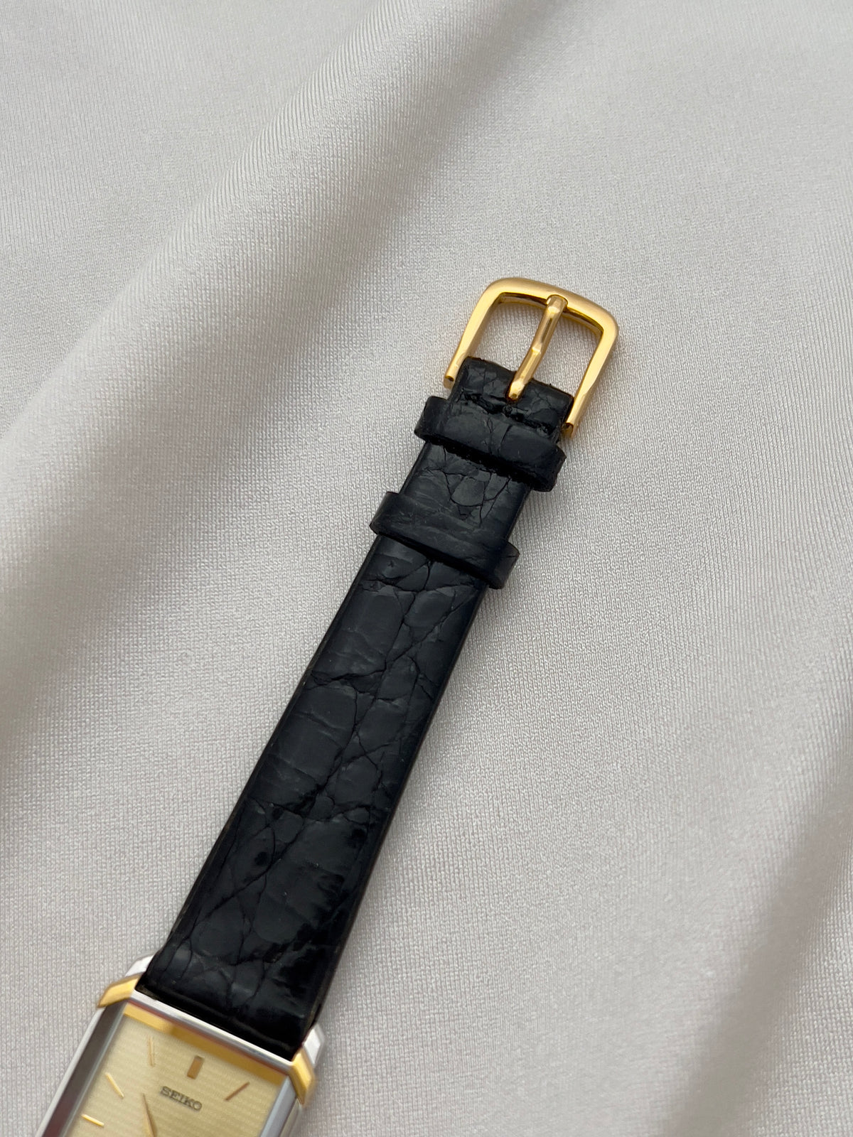 Seiko Exceline Tank Champagne Guilloché Dial Ladies Rectangular Watch, caseback detail of a vintage women's watch at Gilded Hour.