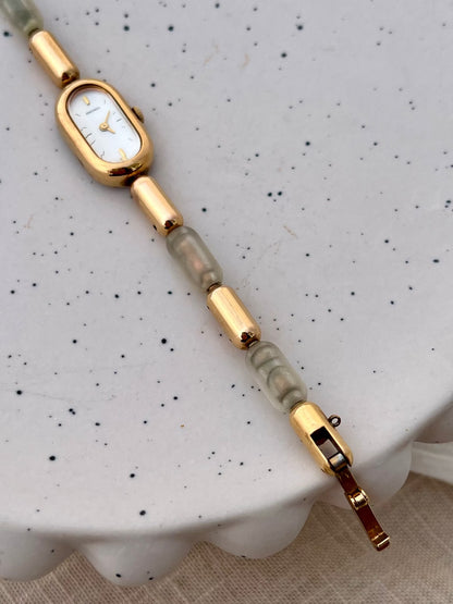 Caseback detail of the Seiko gold-tone capsule watch.
