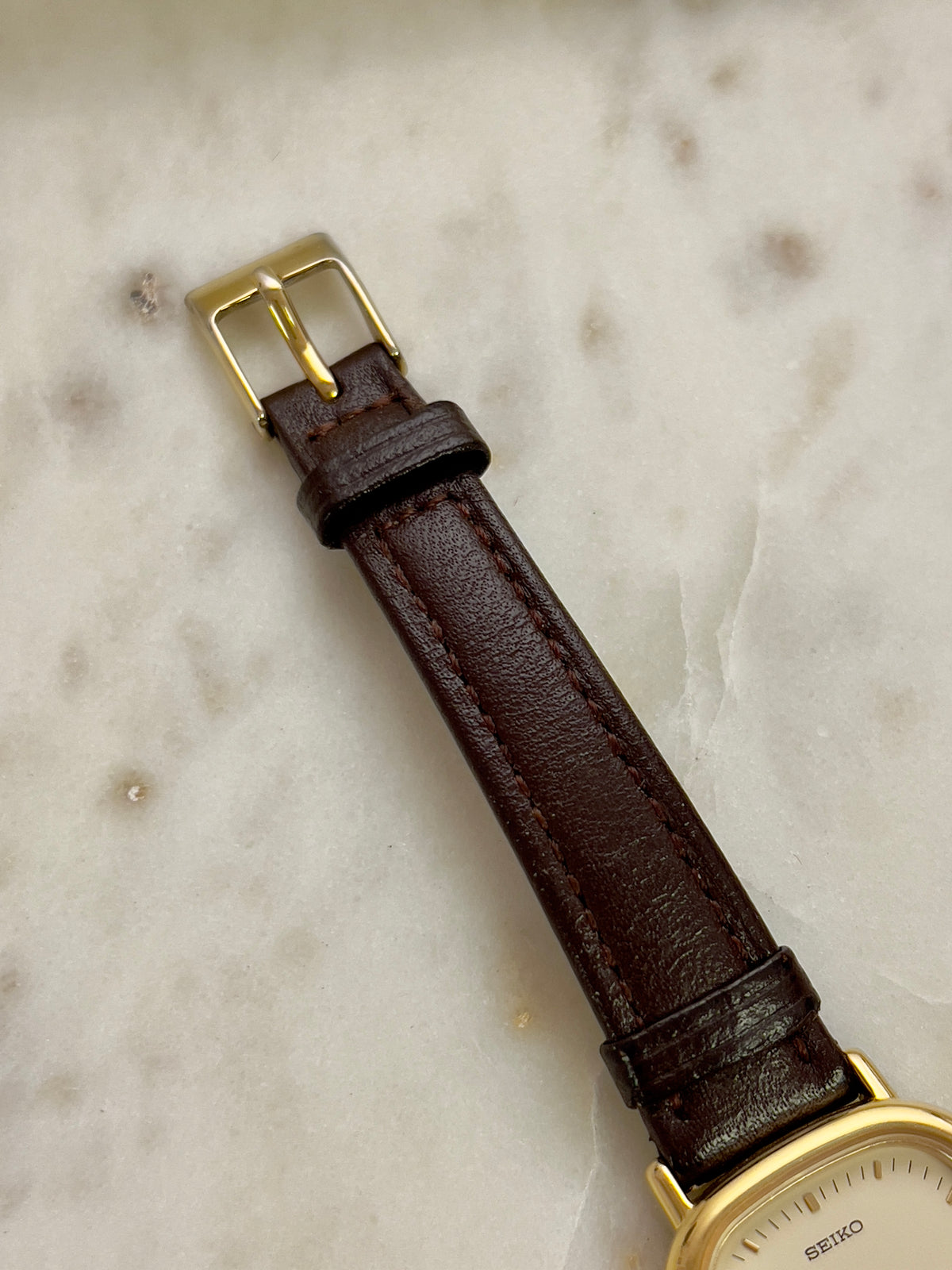 Seiko Gold Toned Cushion Case Woman's Watch, dial close up of a vintage women's watch at Gilded Hour.