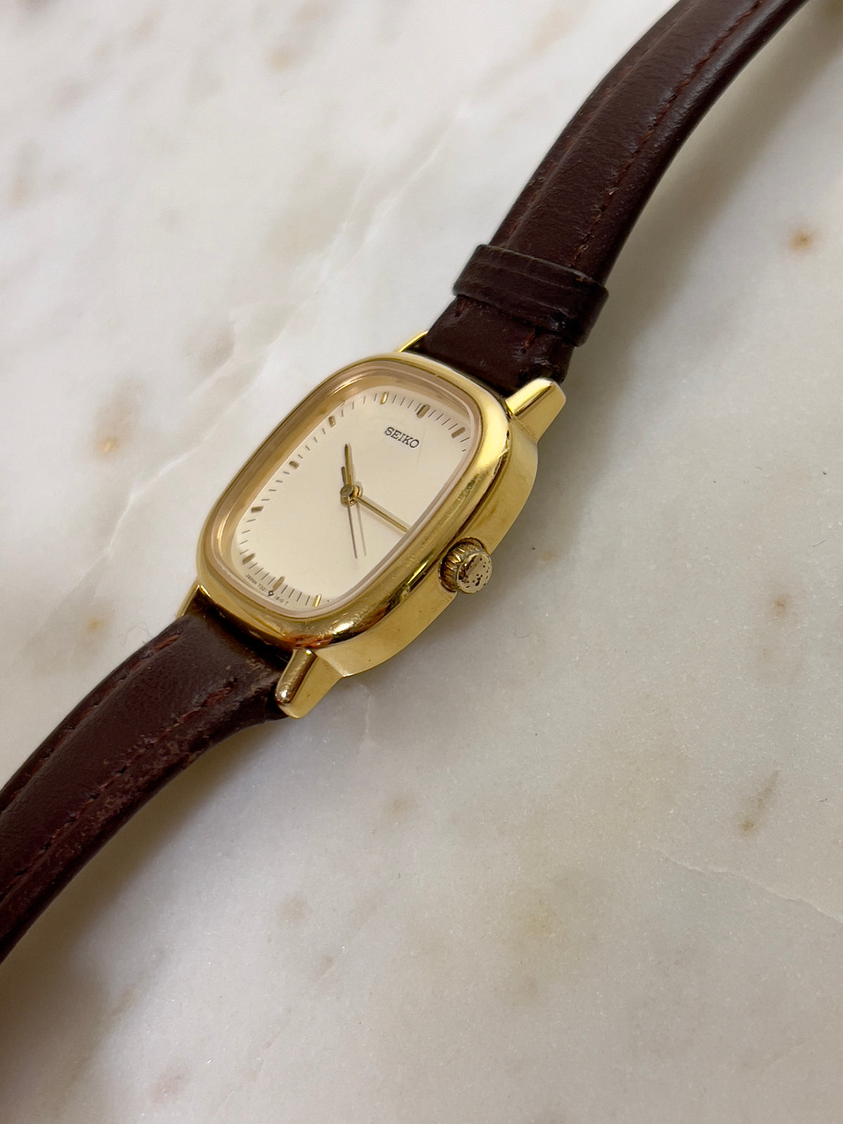 Seiko Gold Toned Cushion Case Woman's Watch, wrist shot of a vintage women's watch at Gilded Hour.