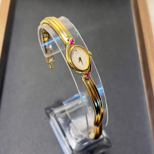 Seiko Gold Bangle Watch with Rubies, product photograph 1.