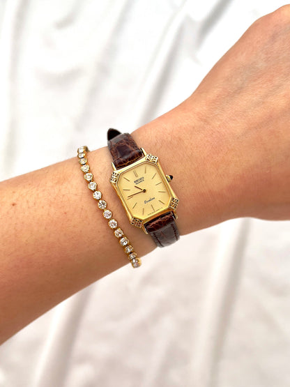 Seiko Exceline Gold Tank Ladies  Watch with Unique Ornate Case, bracelet detail of a vintage women's watch at Gilded Hour.