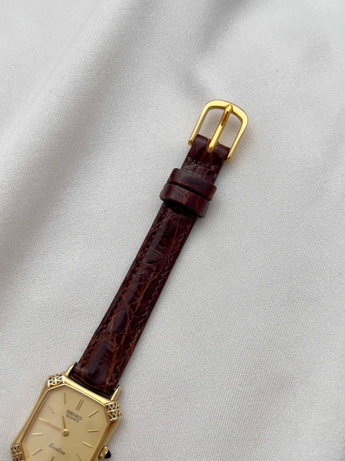 Seiko Exceline Gold Tank Ladies  Watch with Unique Ornate Case, front view of a vintage women's watch at Gilded Hour.