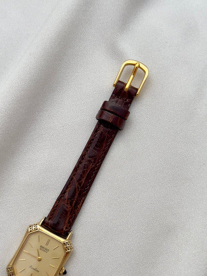 Seiko Exceline Gold Tank Ladies  Watch with Unique Ornate Case, front view of a vintage women's watch at Gilded Hour.