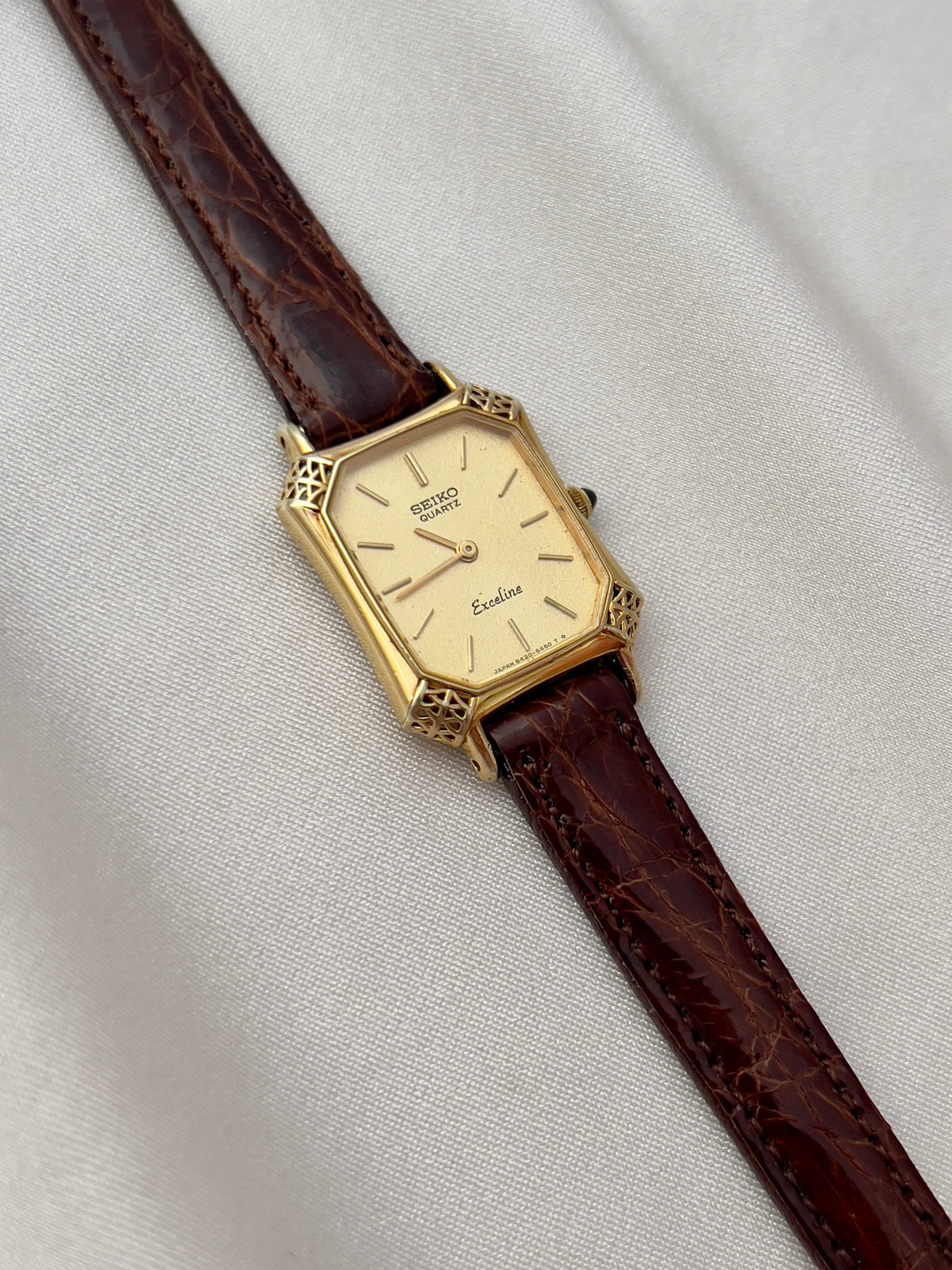 Seiko Exceline Gold Tank Ladies  Watch with Unique Ornate Case, front view of a vintage women's watch at Gilded Hour.