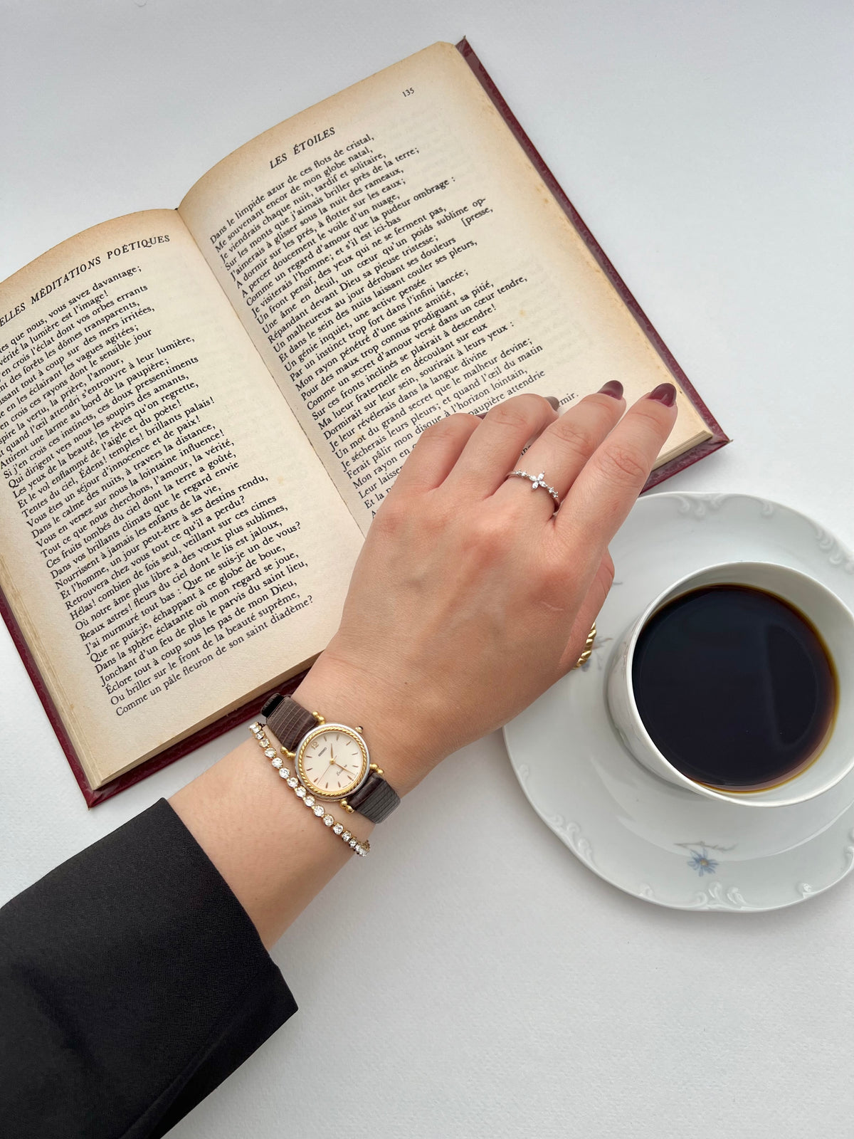Seiko Two Toned Rope Bezel Woman's Watch — the watch worn on a wrist beside jewellery.