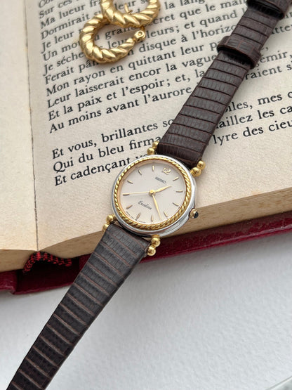 Seiko Two Toned Rope Bezel Woman's Watch — close view of the pale dial and gold rope bezel.