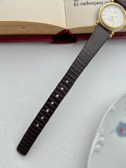 Seiko Two Toned Rope Bezel Woman's Watch — full view of the watch with its dark leather strap.