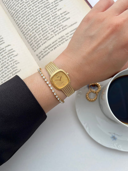 Front view of the Seiko Exceline soft-square gold watch with champagne dial.