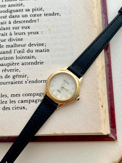 Angled view of the Seiko Exceline coin-edge bezel and sculpted gold lugs.