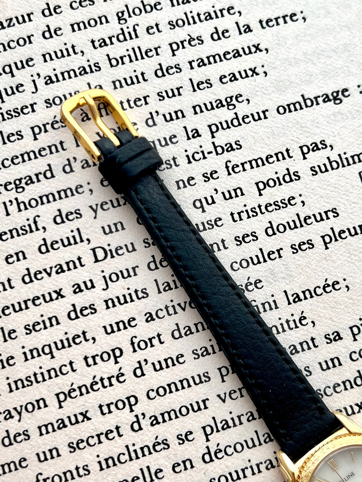 Detail of the black aftermarket leather strap on the Seiko Exceline watch.