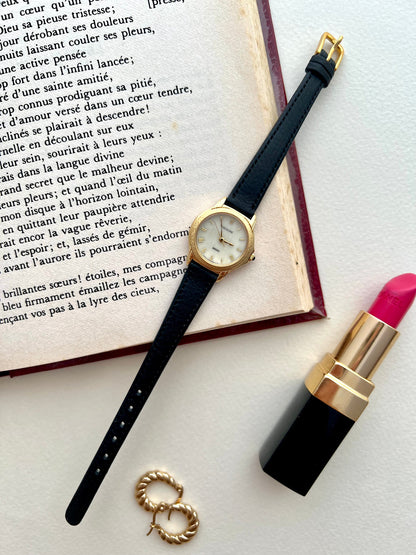 Close-up of the Seiko Exceline mother-of-pearl dial and gold Roman numerals.