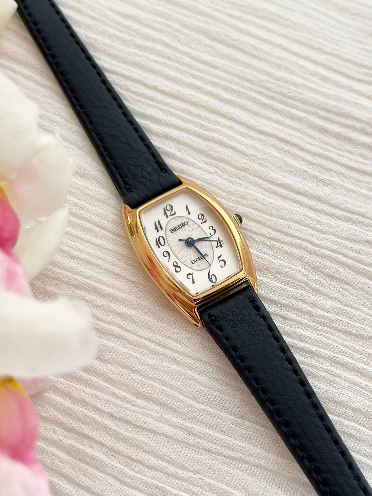 Seiko Exceline Gold Tonneau Women’s Watch with Arabic Dial — close view of case and dial.