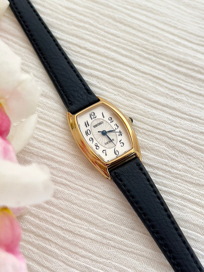 Seiko Exceline Gold Tonneau Women’s Watch with Arabic Dial — close view of case and dial.